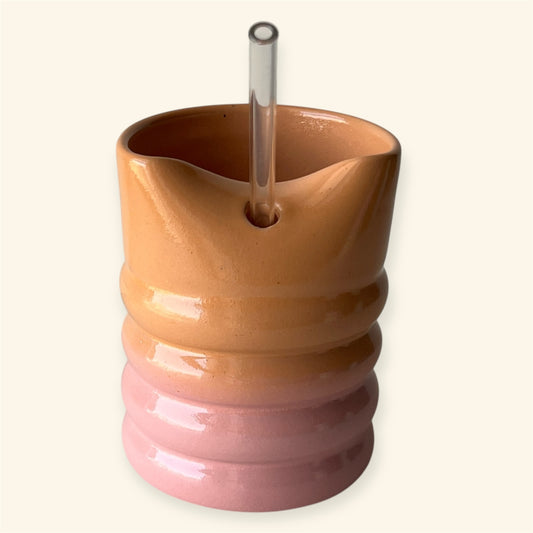 Handmade peach glow ceramic tumbler mug with pottery glaze β medium size for coffee or tea.