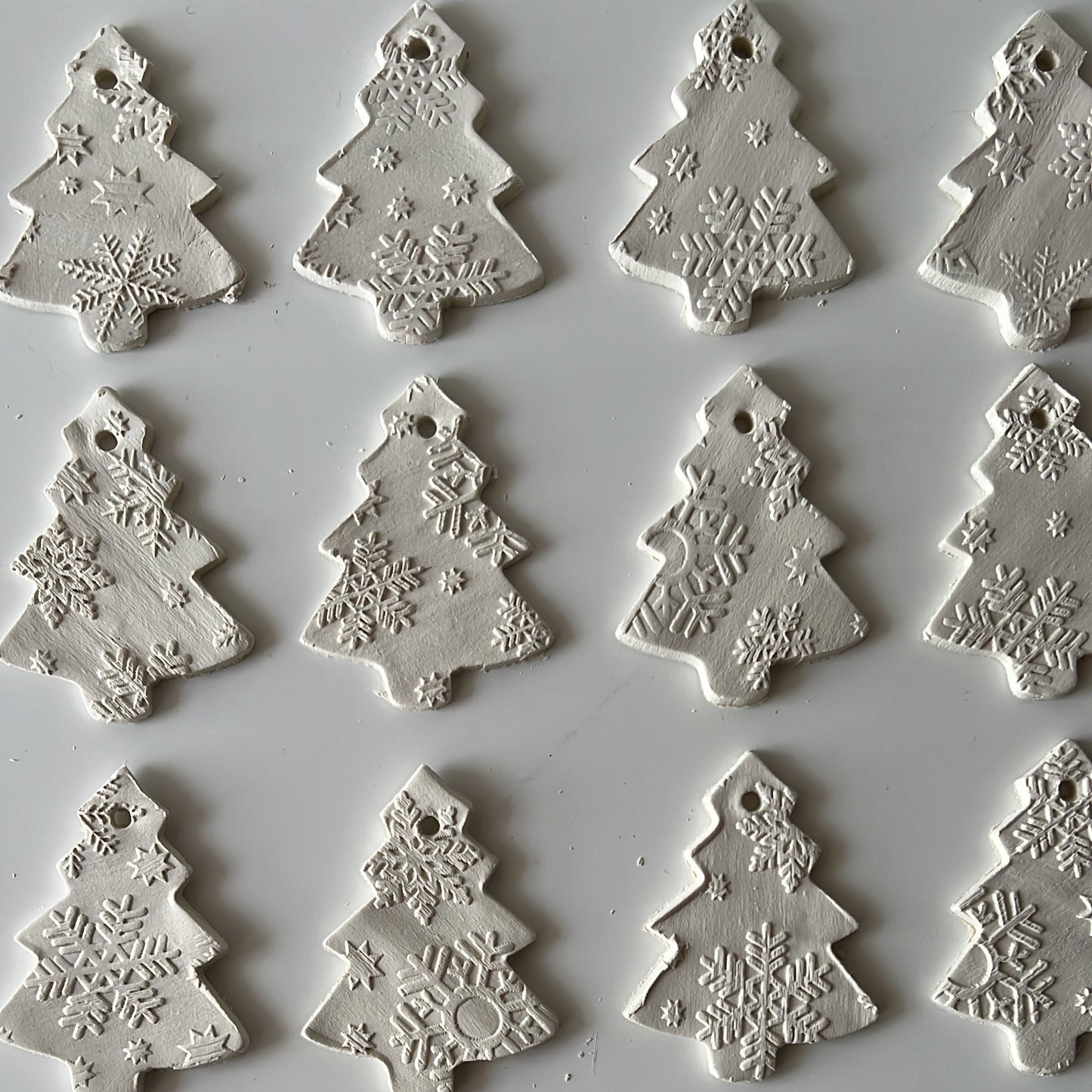 Showing that each tree ornament has a different pattern.