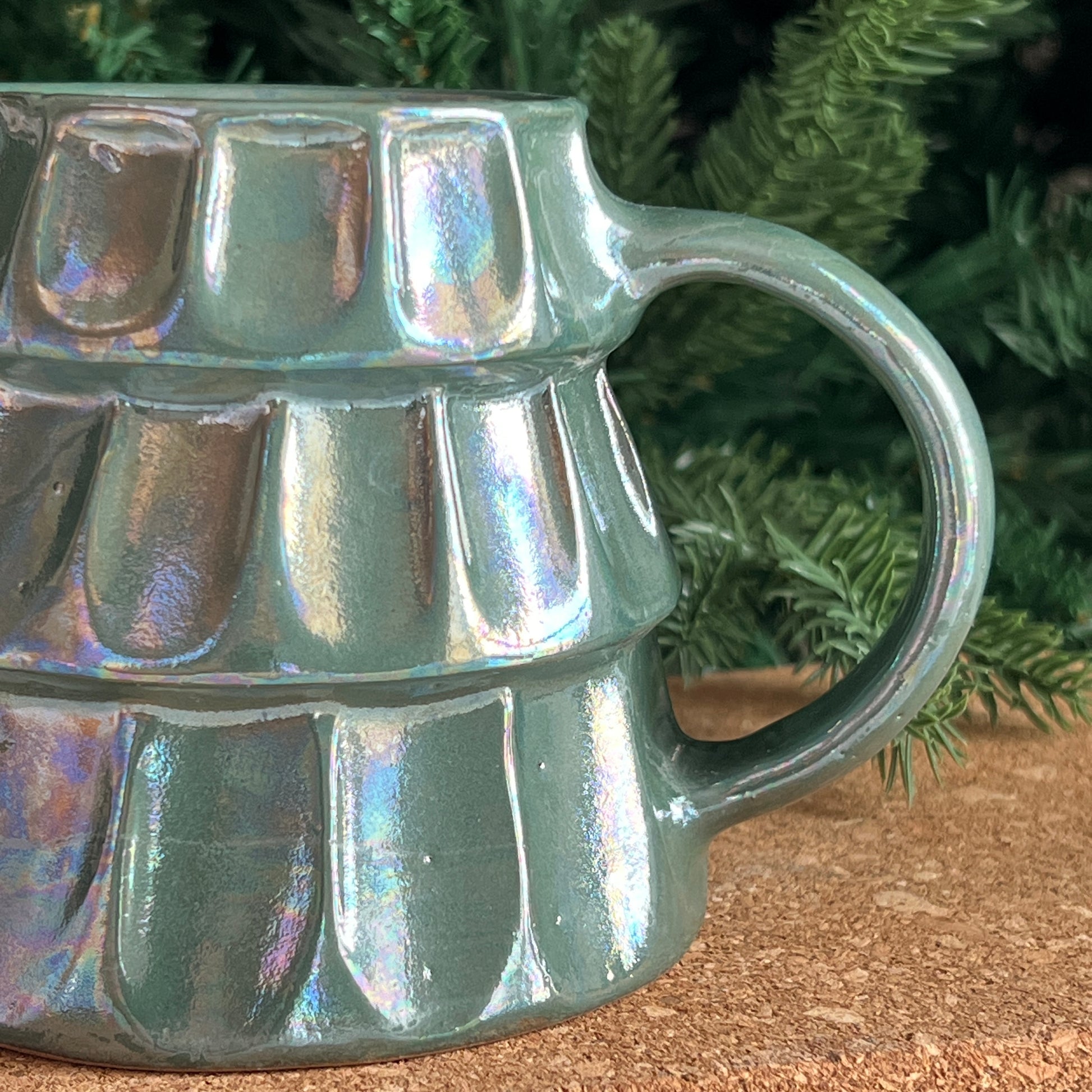 Close-up of artisan hand-painted details on Christmas mug